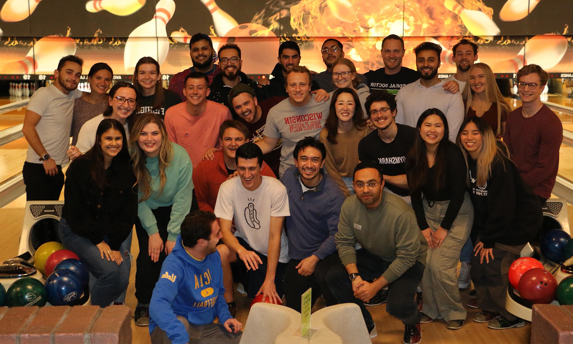 An image of OUWB students bowling and celebrating