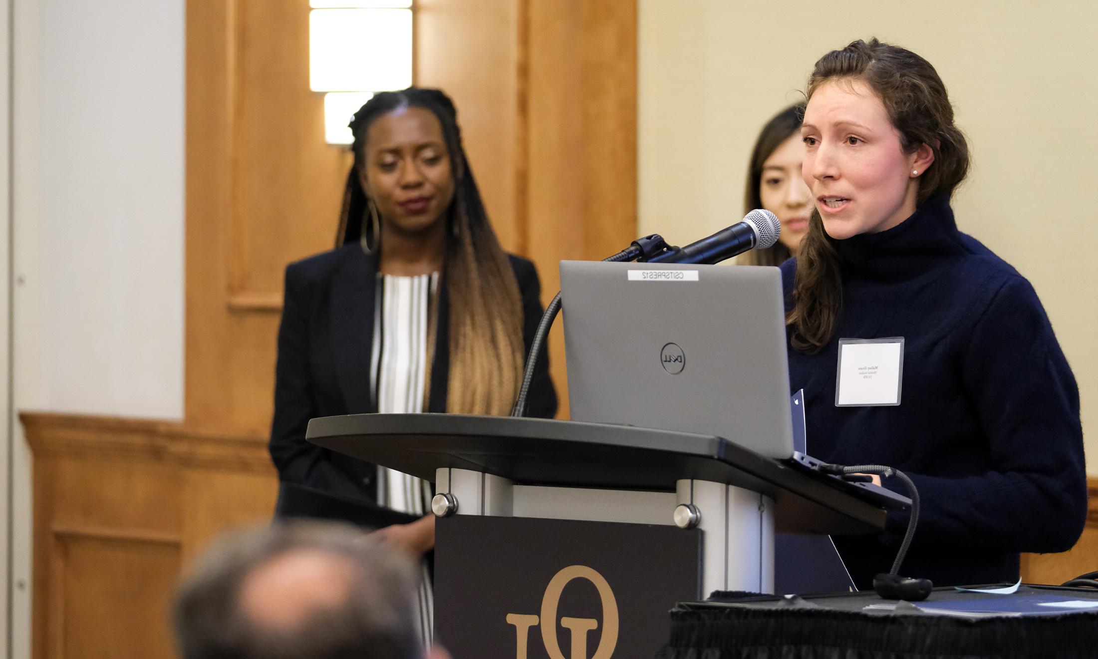 An image of Mallory Evans speaking at the Faircloth Lecture