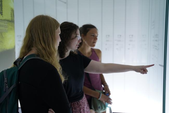 Students visit an exhibit at Auschwitz